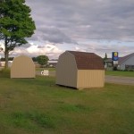 Two gambrel sheds done by Premium Pole Buildings & Storage Sheds