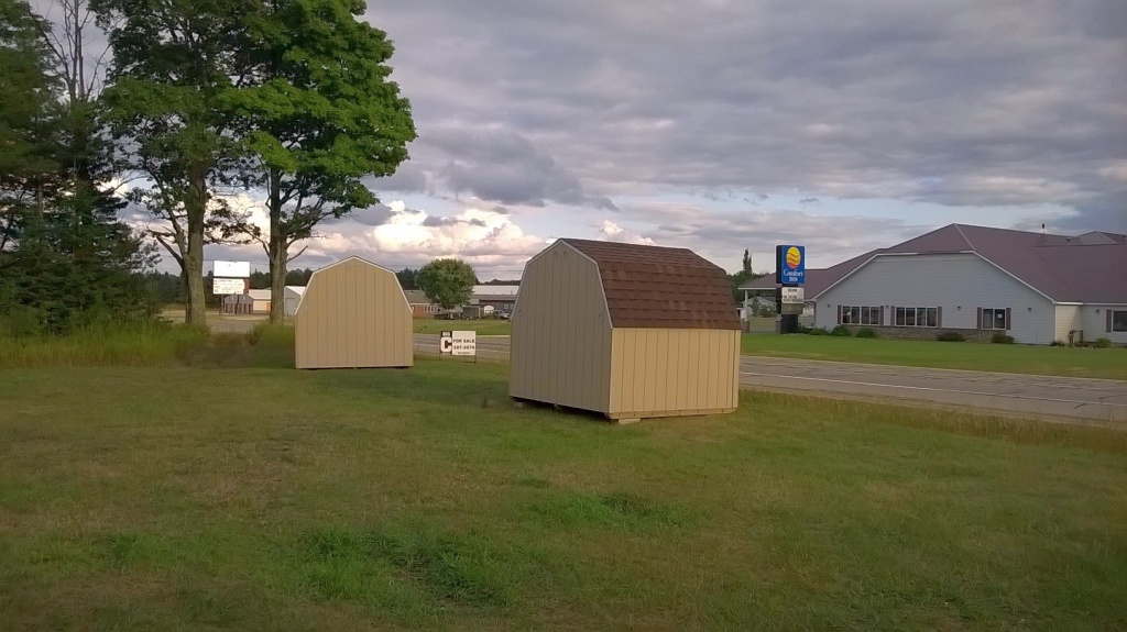 Two gambrel sheds done by Premium Pole Buildings & Storage Sheds
