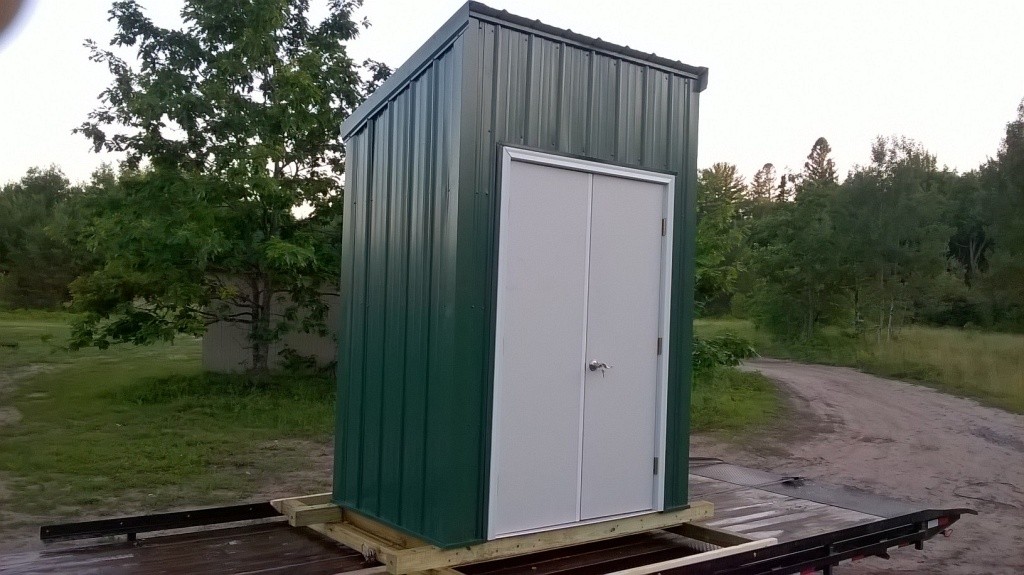 Side view of the green pole building